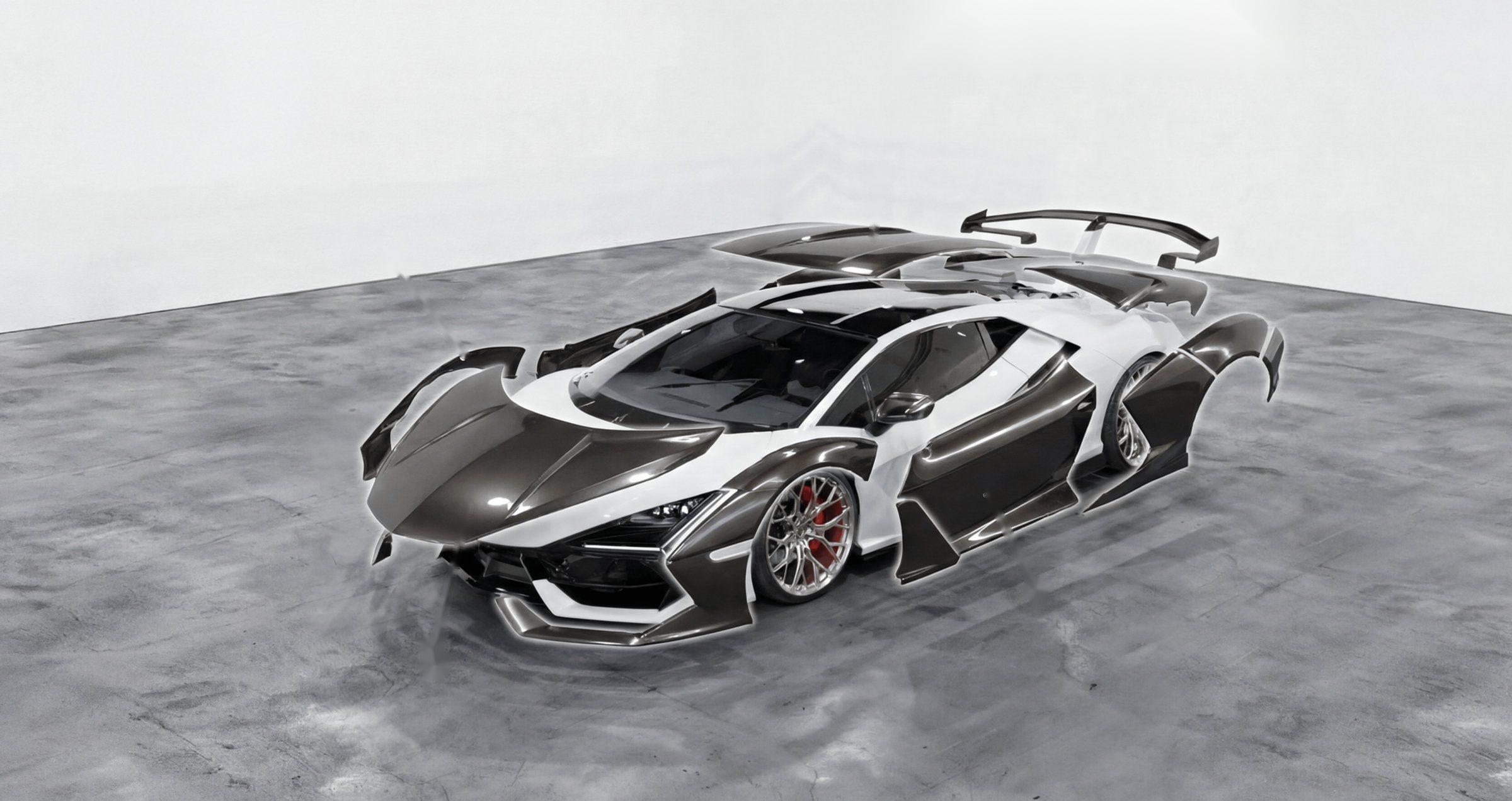 Supercar with body panels separated to show where protective film is applied